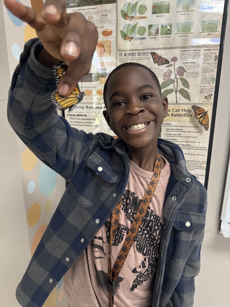 Mrs. Flowers' students with the monarch butterflies they hatched and released
