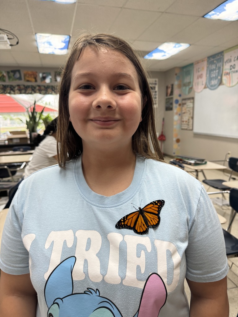 Mrs. Flowers' students with the monarch butterflies they hatched and released