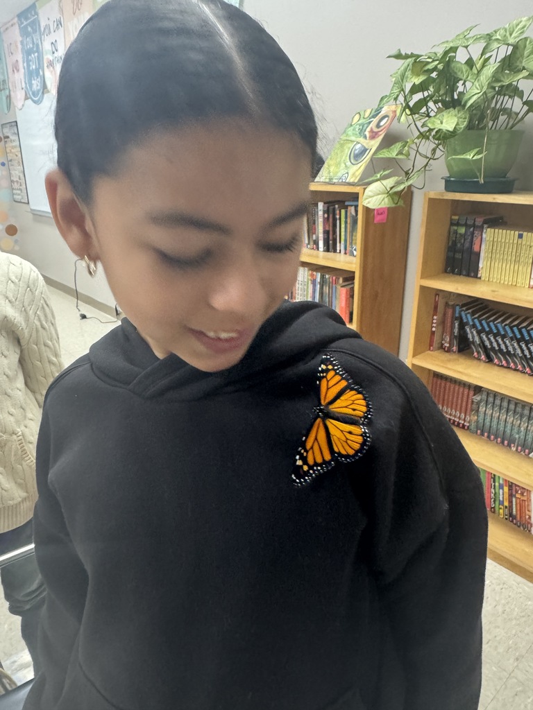 Mrs. Flowers' students with the monarch butterflies they hatched and released