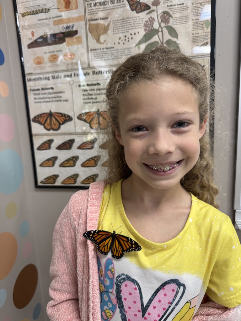 Mrs. Flowers' students with the monarch butterflies they hatched and released