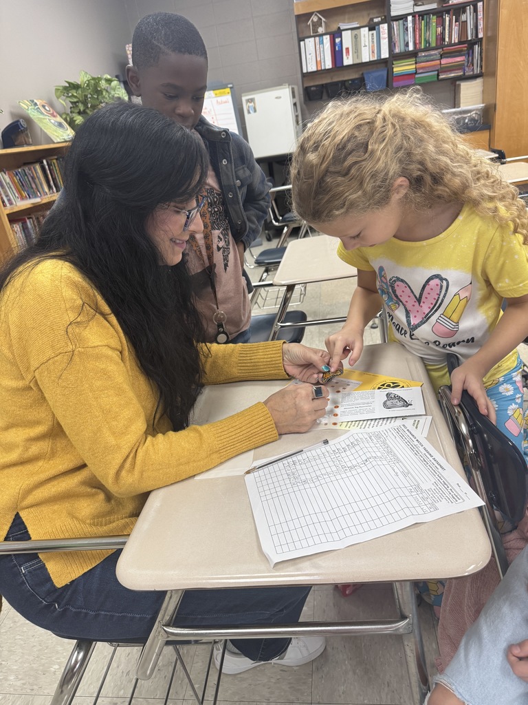 Mrs. Flowers' students with the monarch butterflies they hatched and released