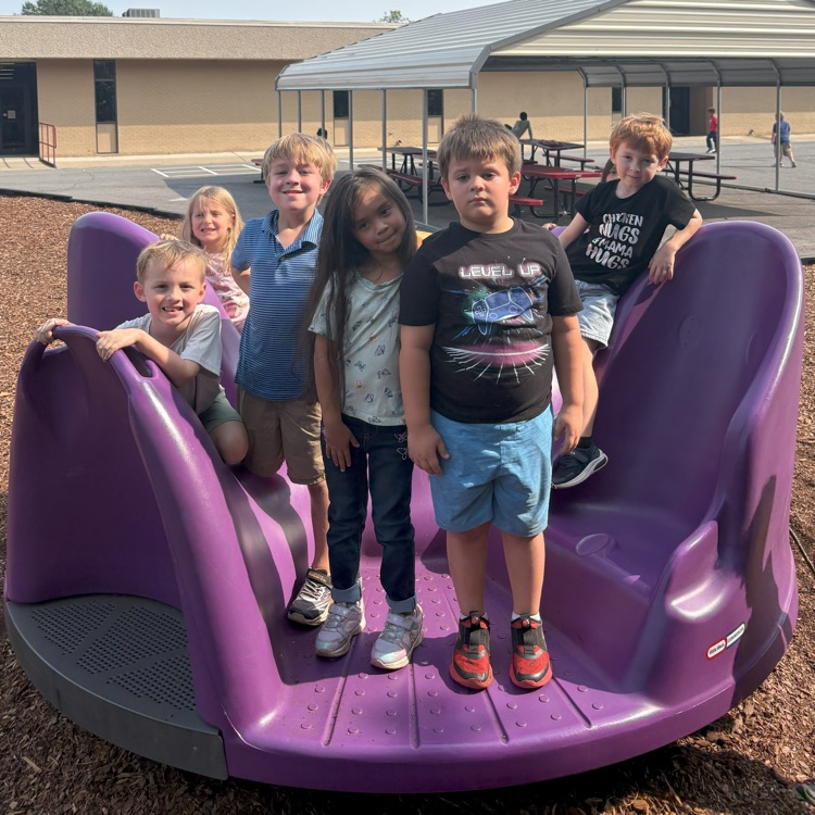 kindergarten kids playing on playground 