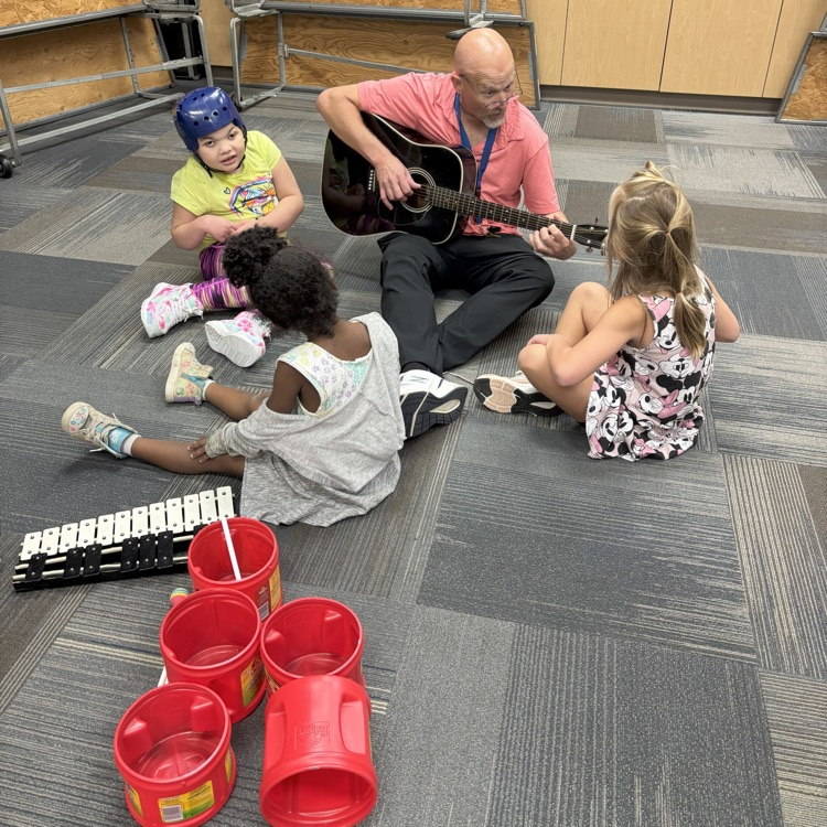 Mr Cole singing with students  