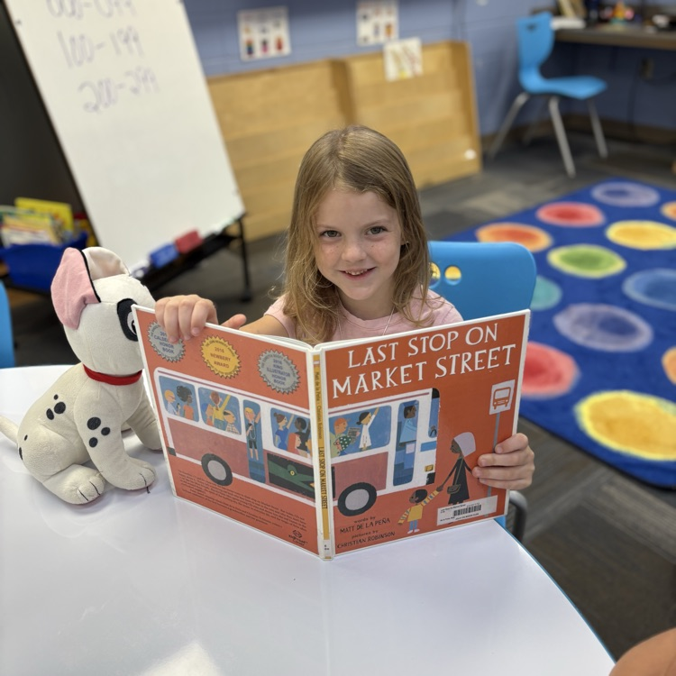 kindergarten kids reading to book buddies 