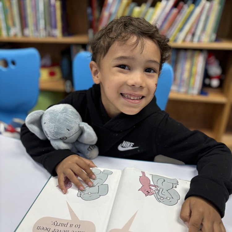kindergarten kids reading to book buddies 