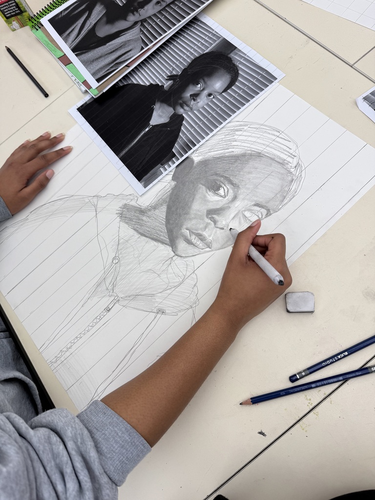 Students begin drawing altered self portraits.
