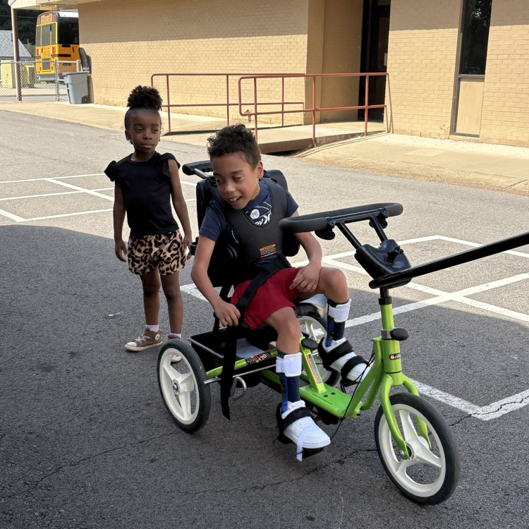 student riding bike