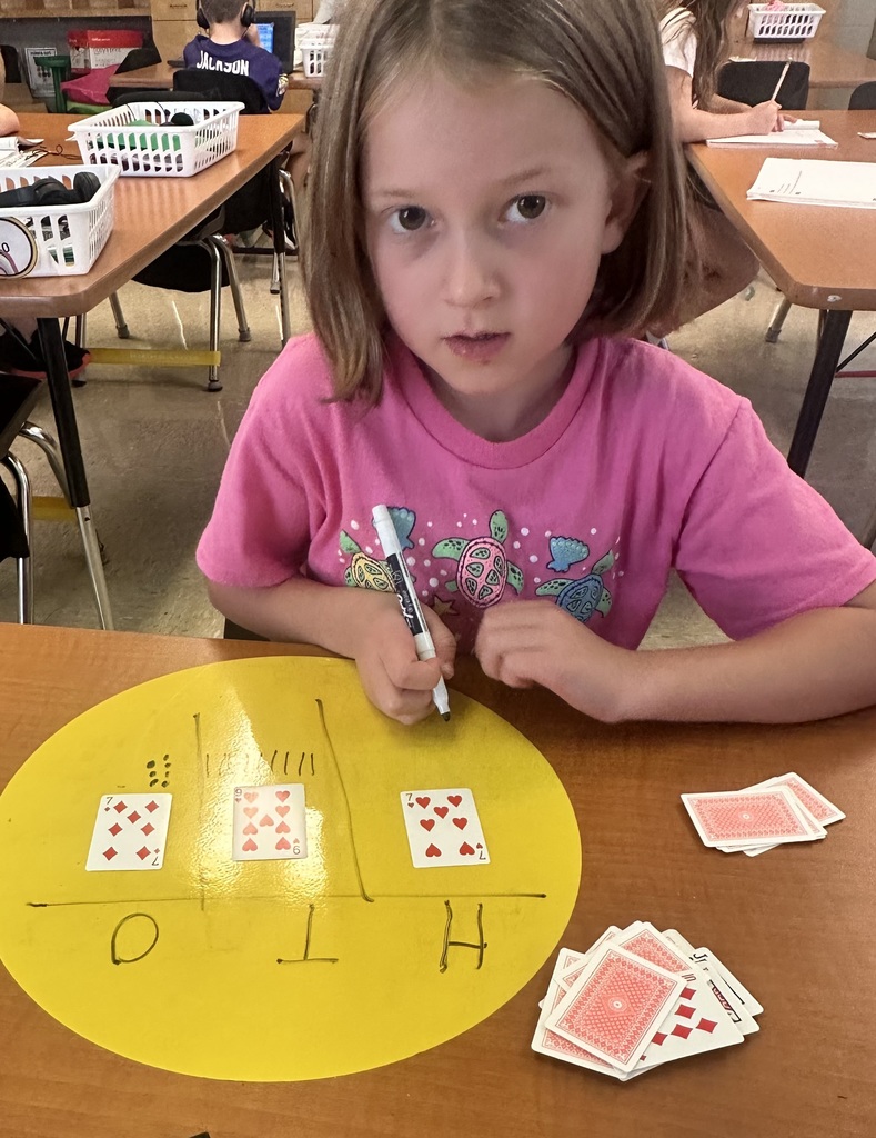 💡2nd graders are showing off their place value skills with number cards in small groups and centers today!