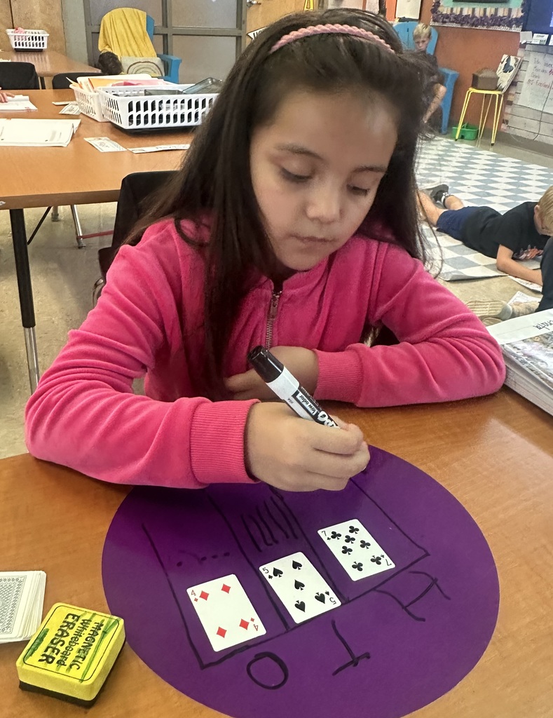 💡2nd graders are showing off their place value skills with number cards in small groups and centers today!