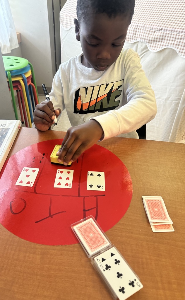 💡2nd graders are showing off their place value skills with number cards in small groups and centers today!