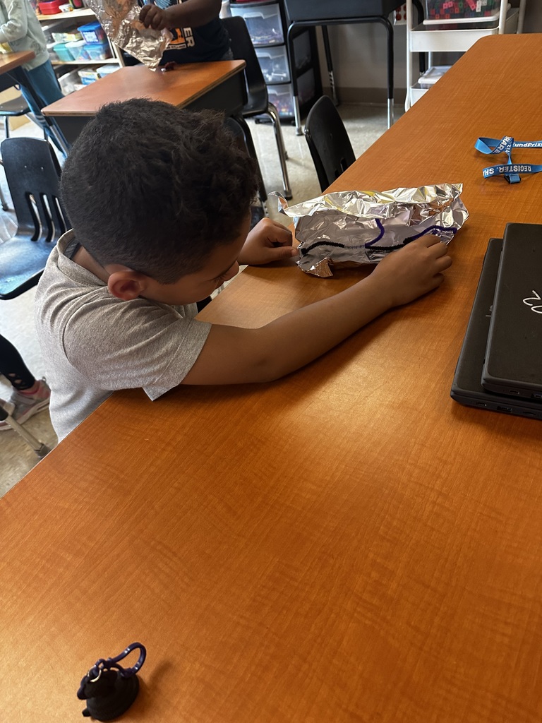 vDuring their reading unit about Habitats, Mrs. Cossey’s class made animals using UV beads and habits. They tested their habits outside to see if they protected their animals. If they did their UV bead animals stayed clear, if they changed purple they had to redesign their habits to better protect.