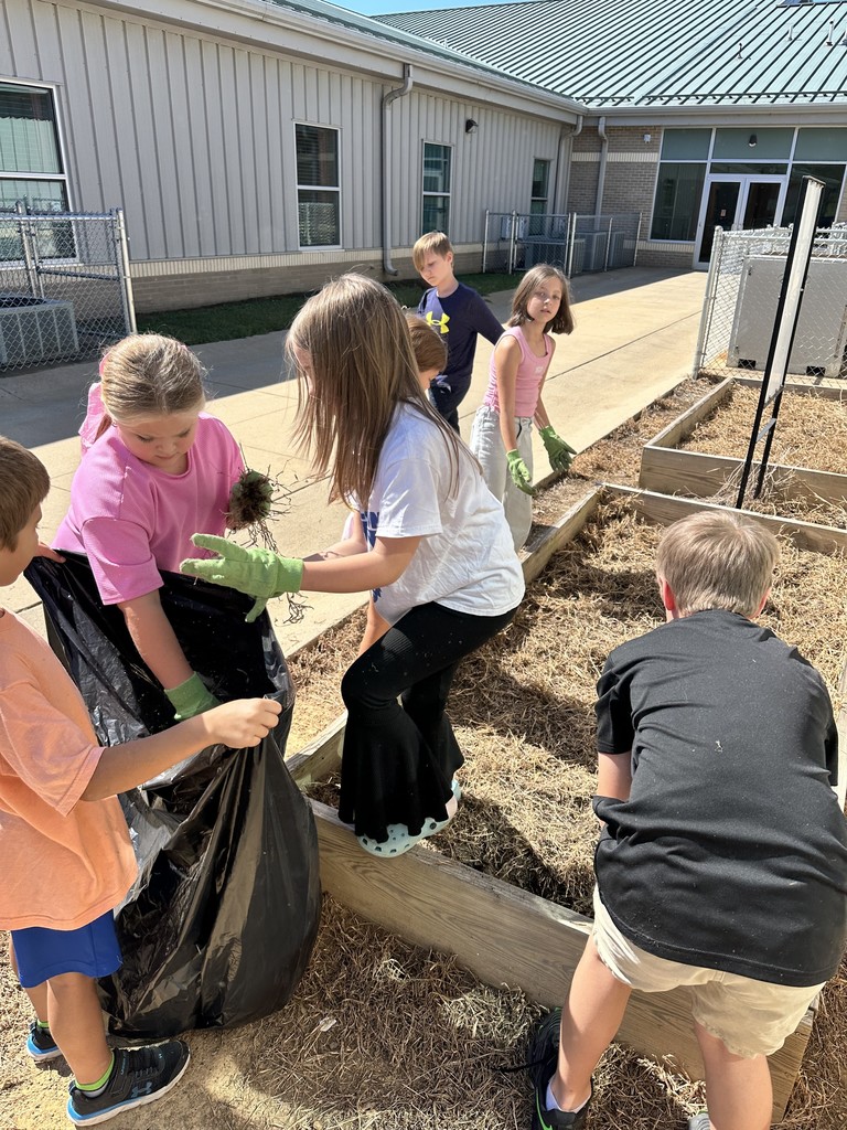 4th grade garden helpers are getting our flower beds cleaned and prepped for our future butterfly garden!