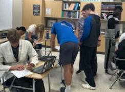 Groups of students working on collecting data.