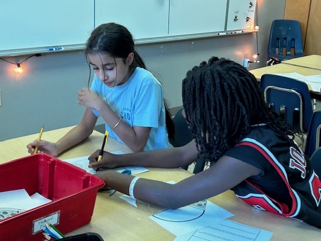 students using manipulatives to divide fractions
