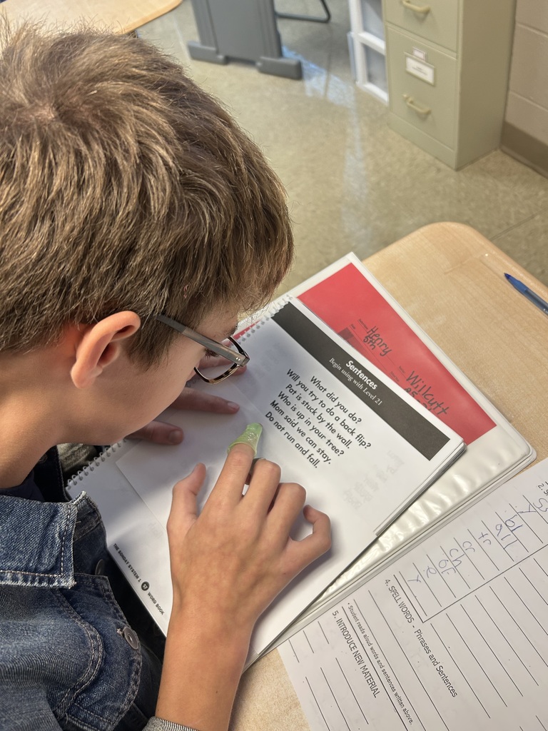 Students practicing tracing words