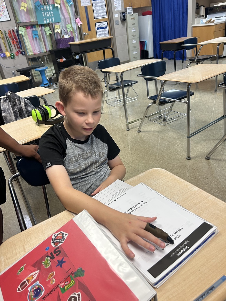 Students practicing tracing words