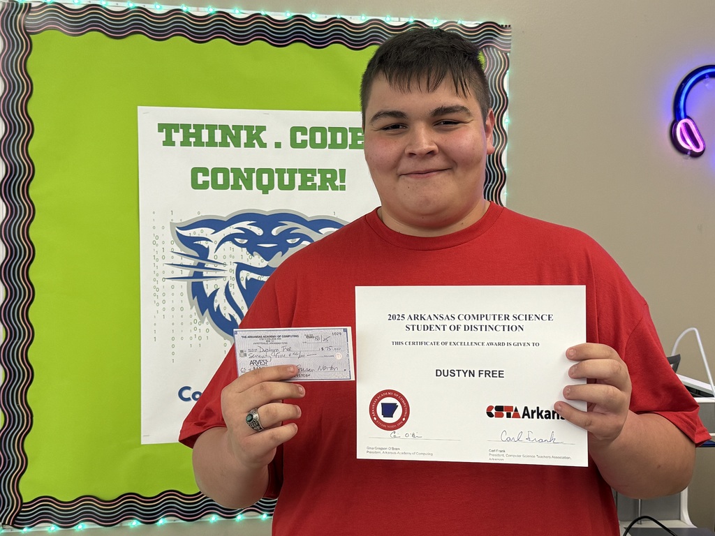 Dustyn Free proudly holds up his award.