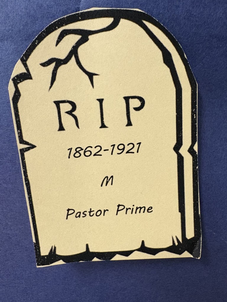 Paper tombstones on a paper graveyard. Students studying the data.