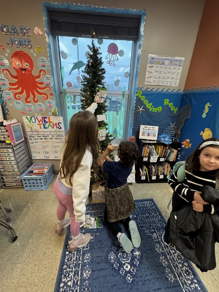 Mrs. Wilcox's classroom elf, Holly Jolly, provided us with ornaments to decorate their Christmas tree today. They are curious to see what she has in store for them next! 