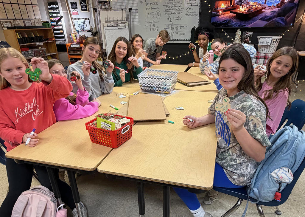 Students making holiday ornaments.