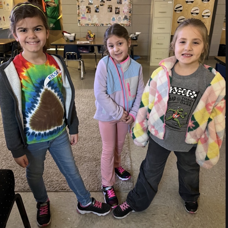 three kids show off shoes