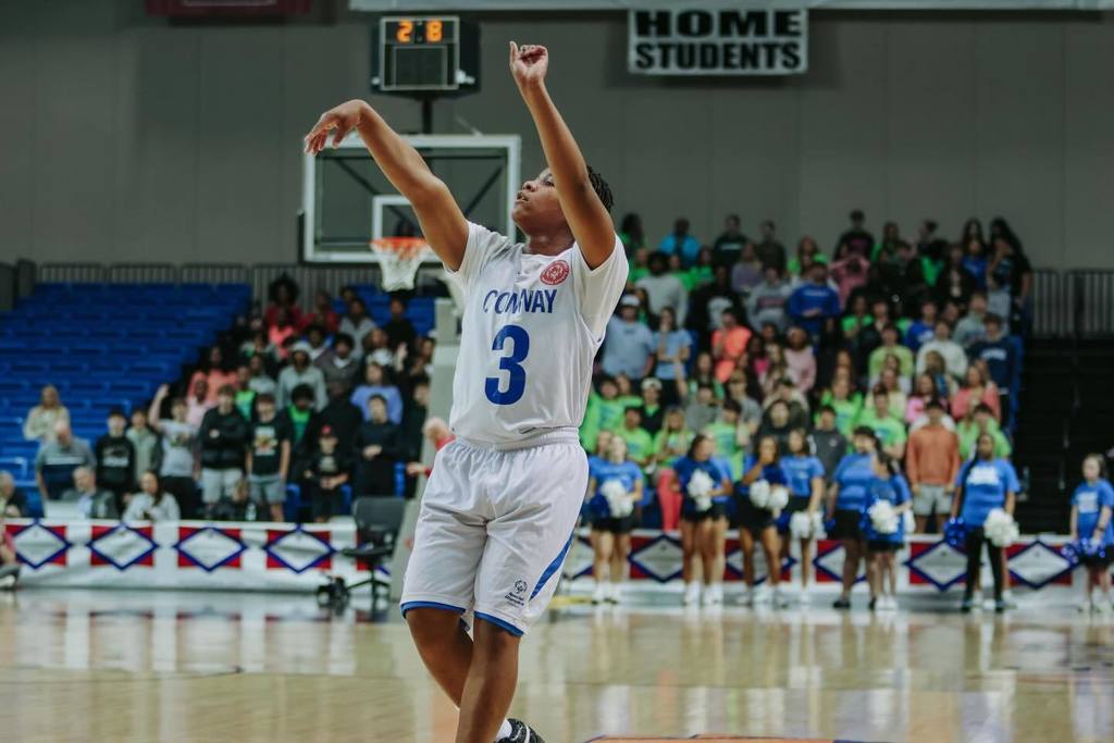 conway basketball player shooting a basket