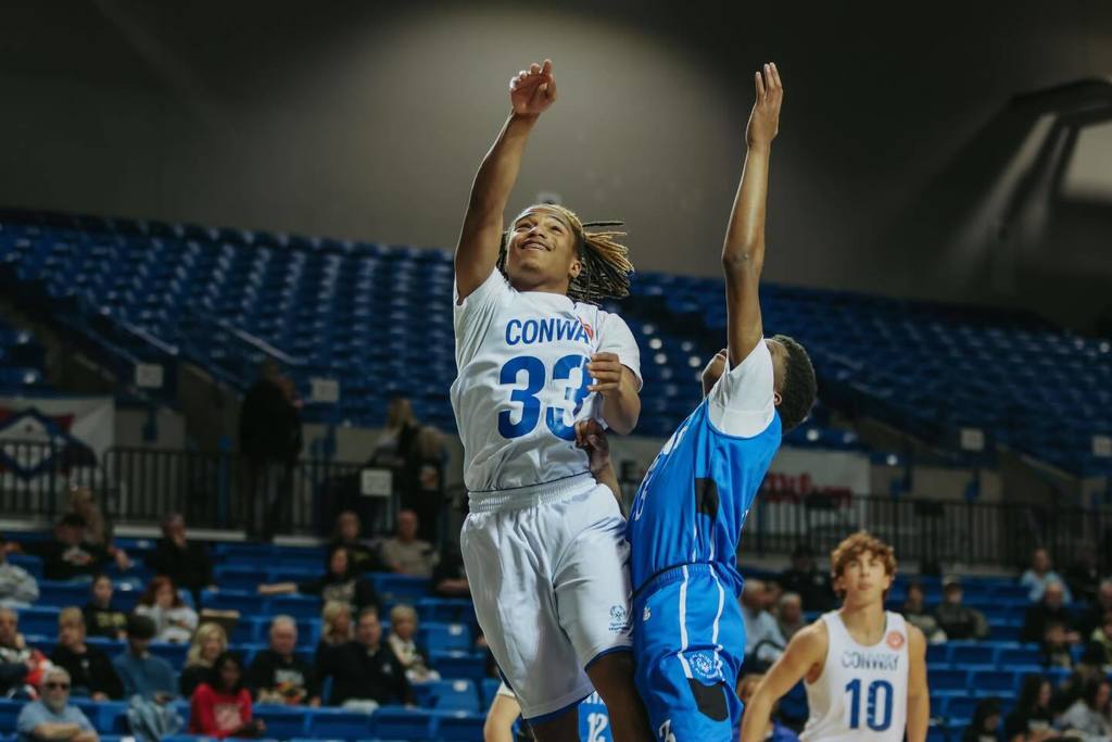 conway and bryant player jumping for the ball