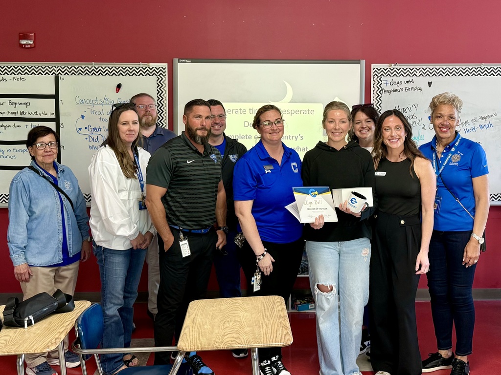Teacher of the Week, Alye Bell, surrounded by CHS administration and central office personnel, including Superintendent Black.