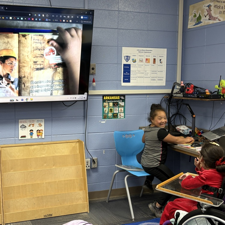 student reading to class