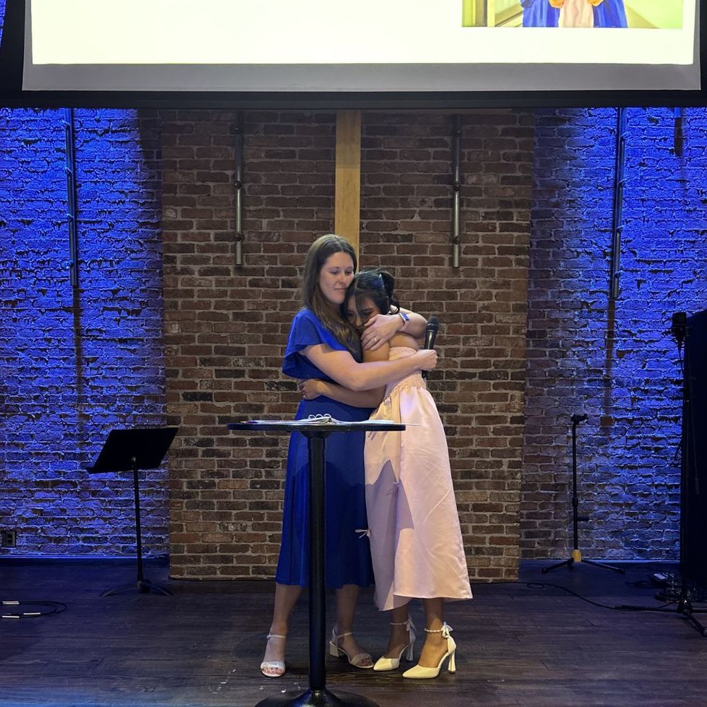 Ms. Smith congratulating a student.