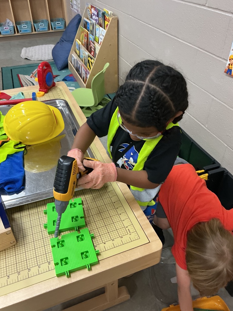 children using toy screwdriver