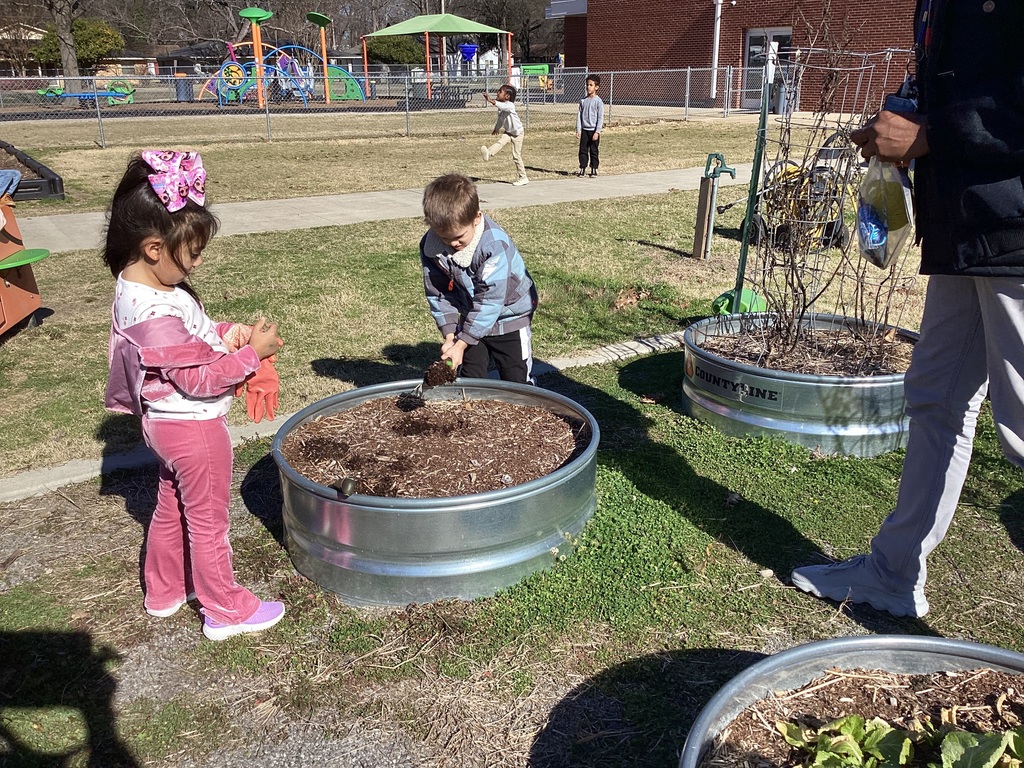 children helping in the garden 