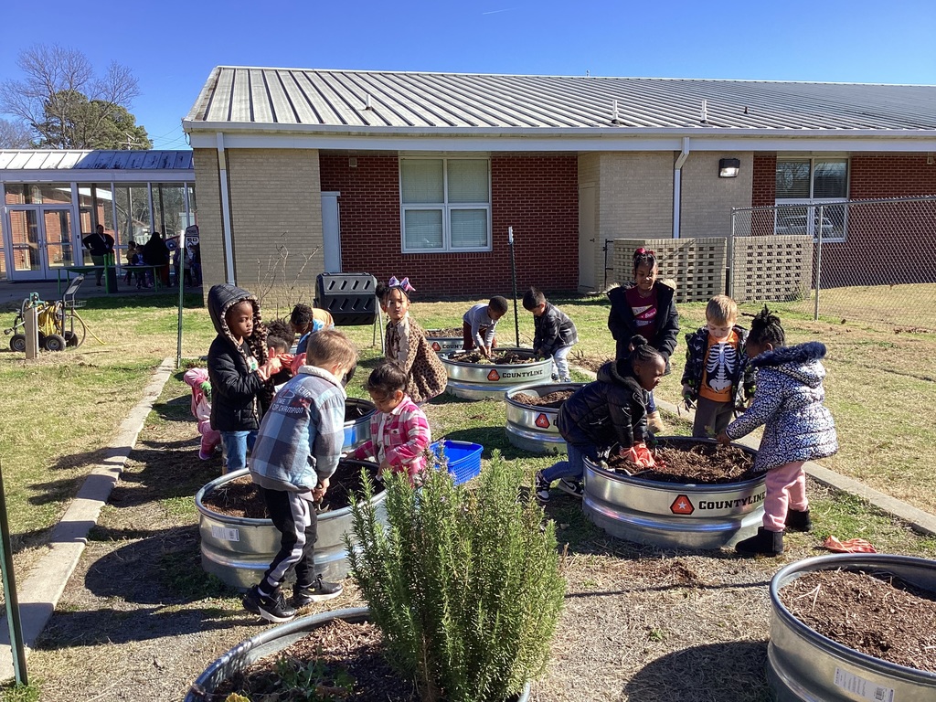 children helping in the garden 