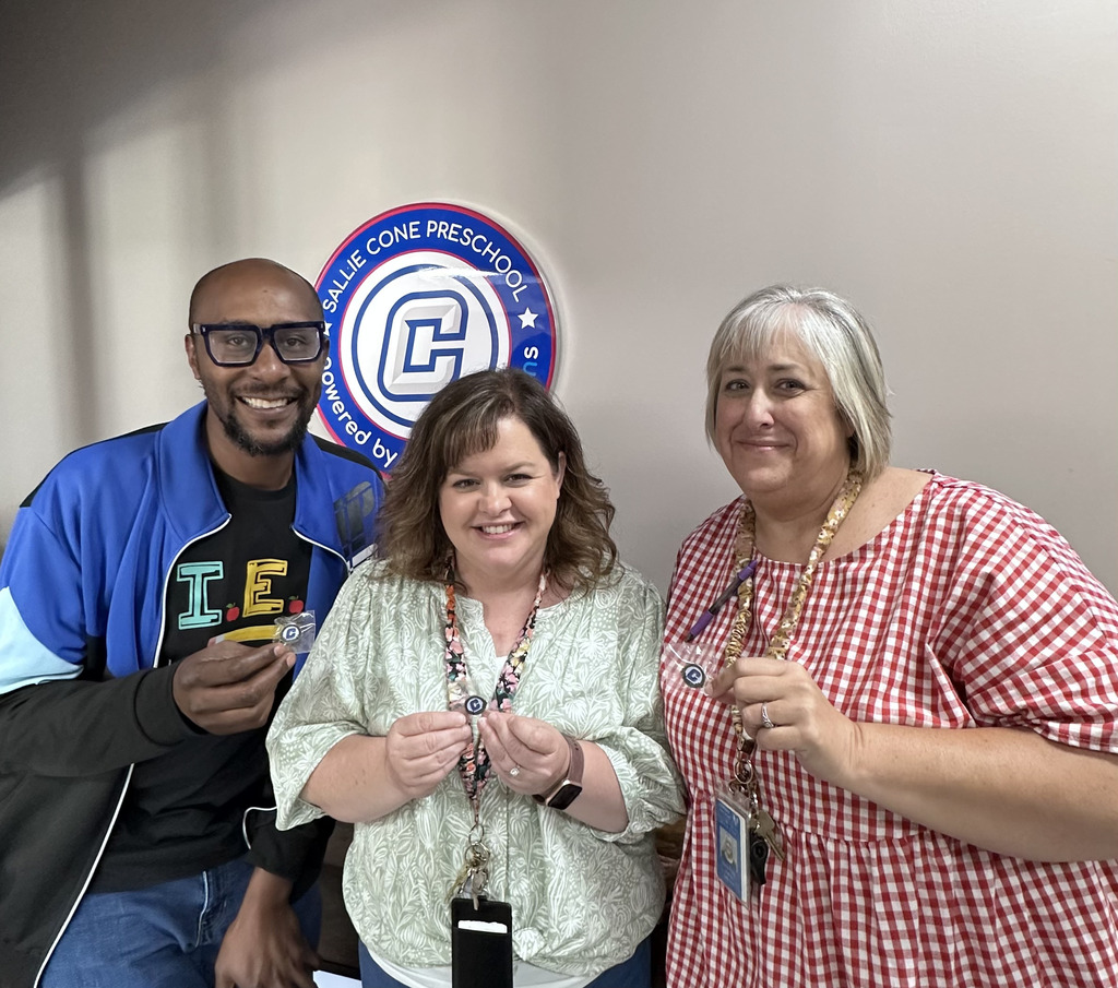 teachers posing with their awards