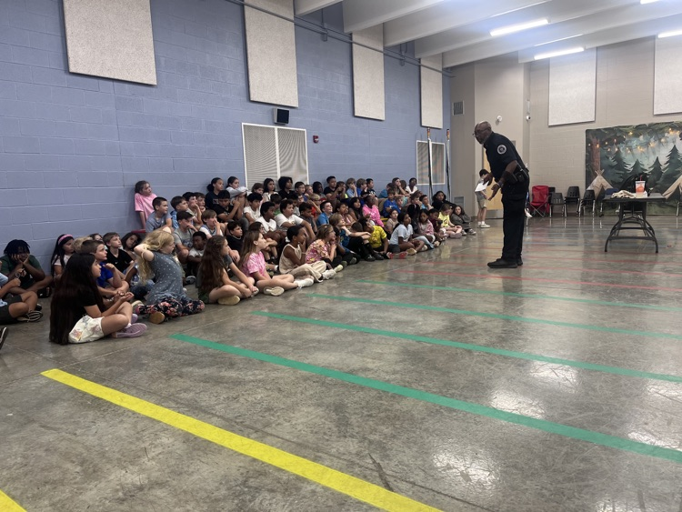 Officer Flowers talking to the fourth graders about Ruth Doyle, how to be trustworthy, being a good peer, respect and rules. 