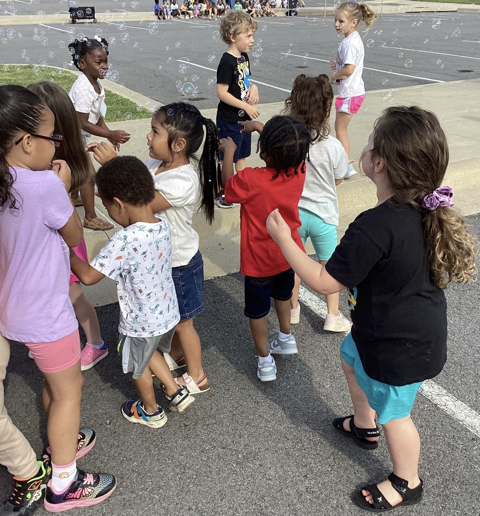 kids having fun with bubbles and dancing