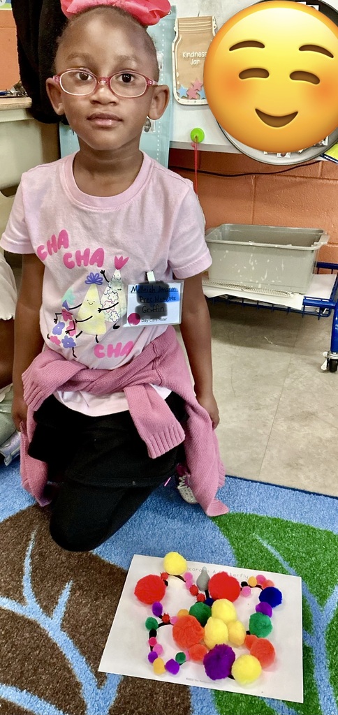 child using loose parts to design a bug