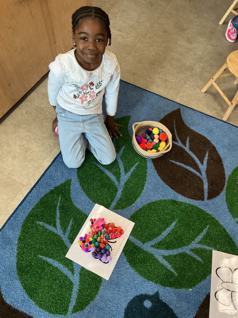 child using loose parts to design a bug