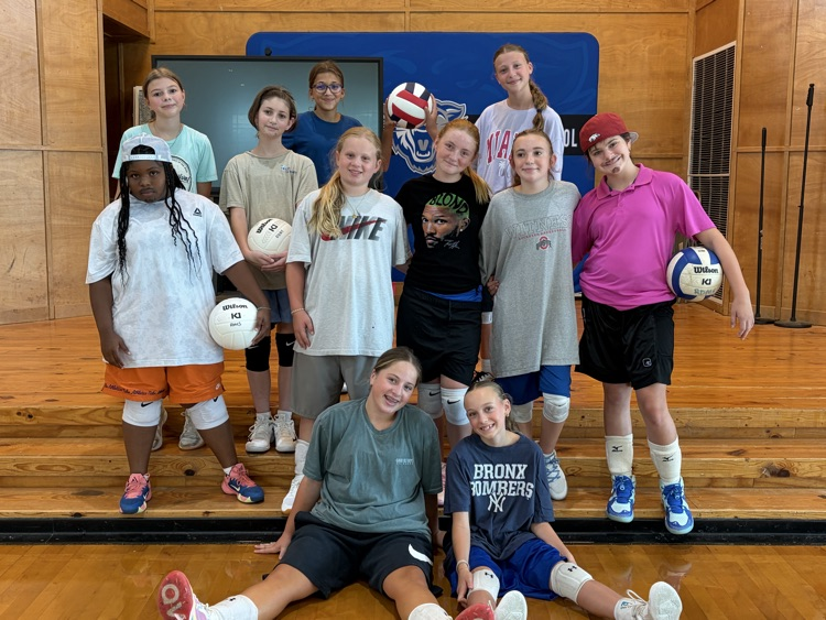 Ruth Doyle volleyball girls having fun during “baggy” day practice.