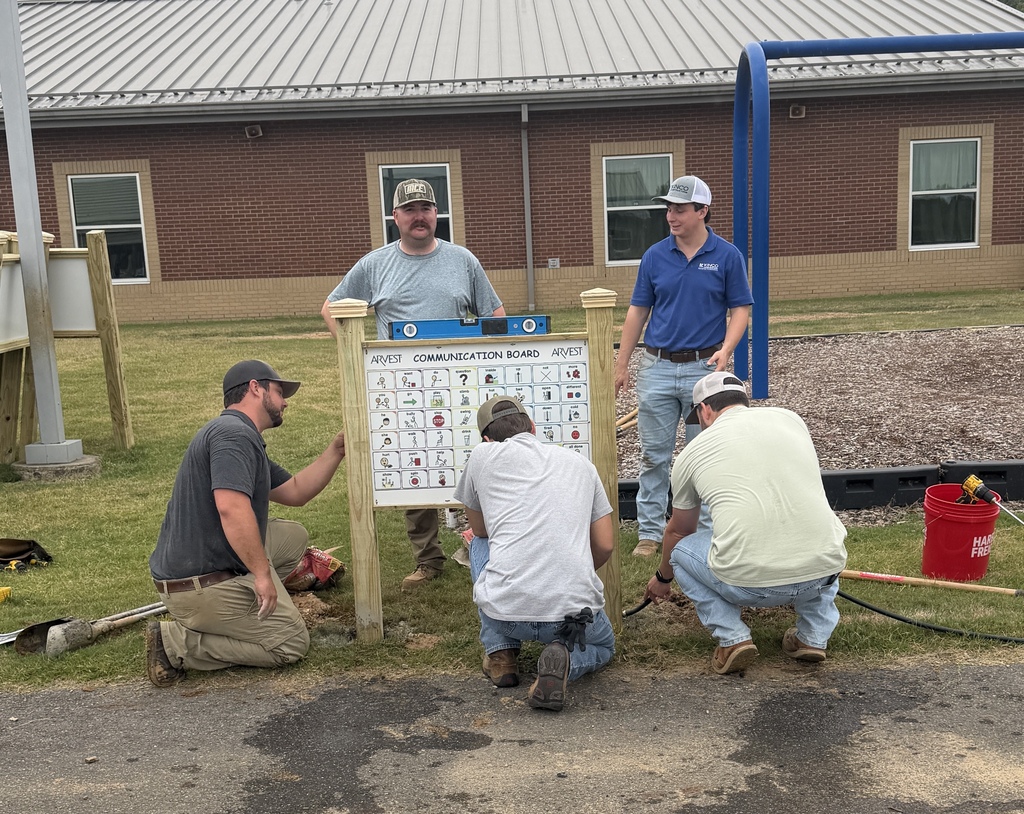 Construction Workers Putting up Communication board on playground