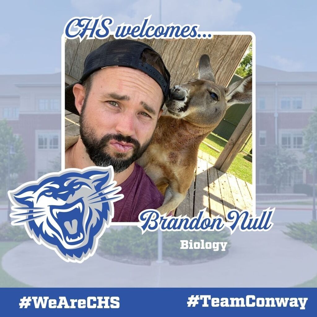 Image of Brandon Null posing with a kangaroo.