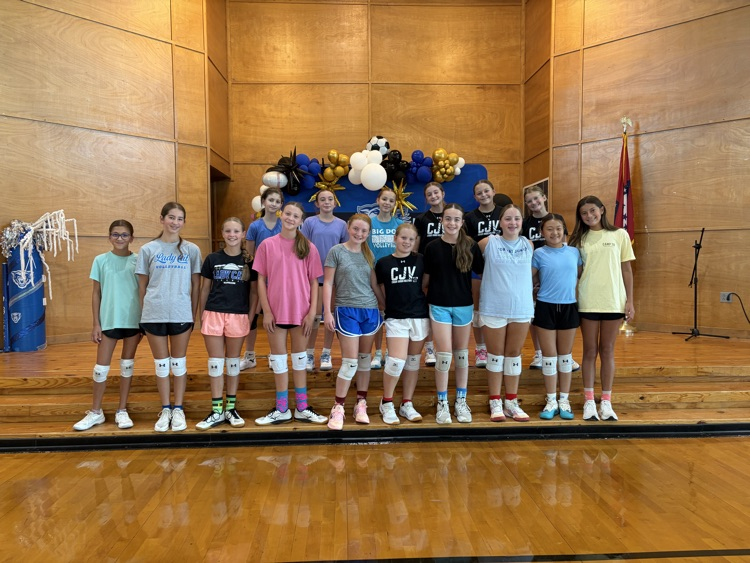 Ruth Doyle volleyball getting in some fun before the season opener with crazy sock practice.