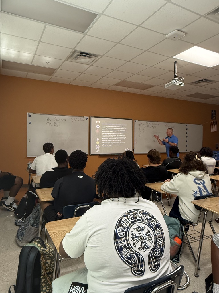 Dax Hill instructing students.