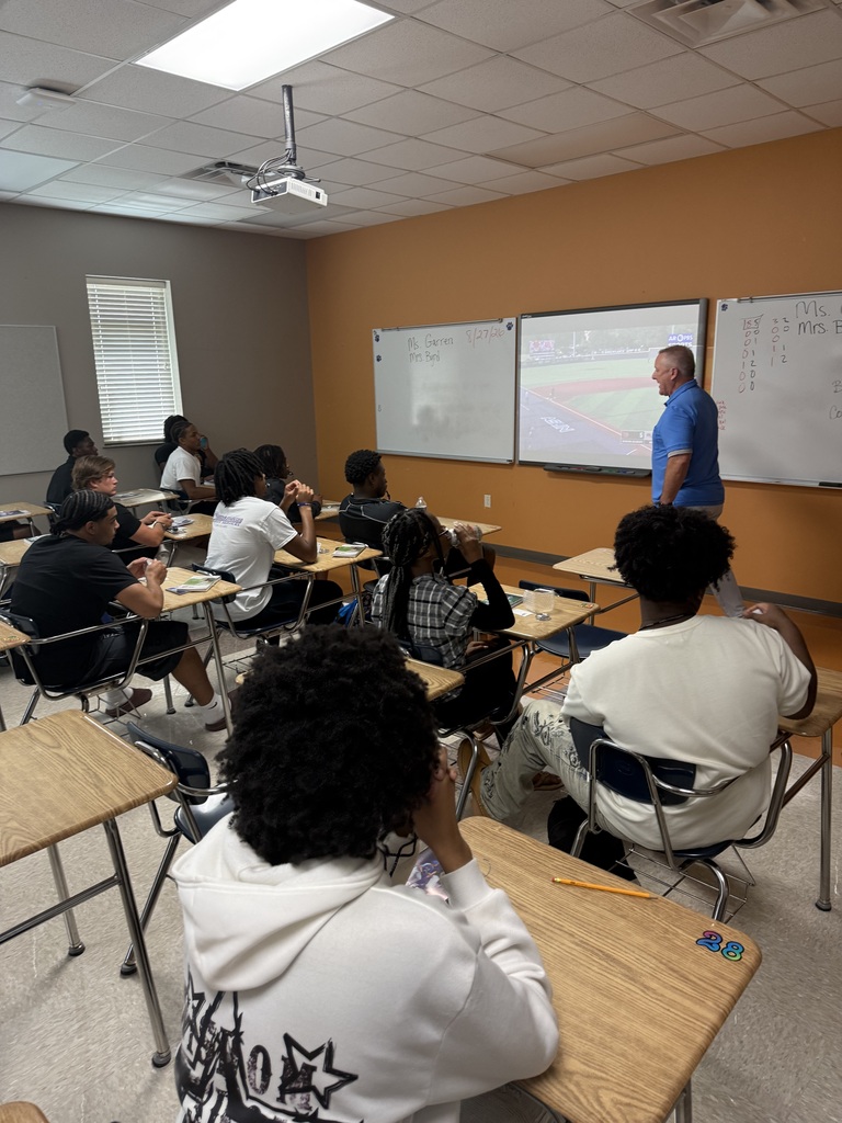 Dax Hill instructing students.