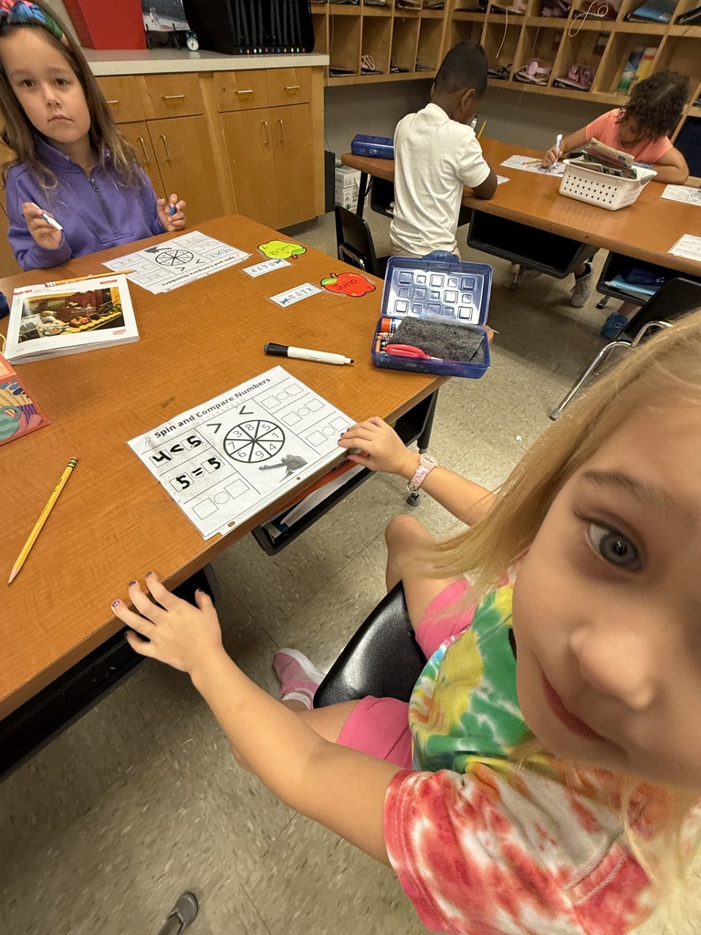 In math we are comparing numbers- today we played a game to review using symbols that that show greater than, less than , and equal to.
