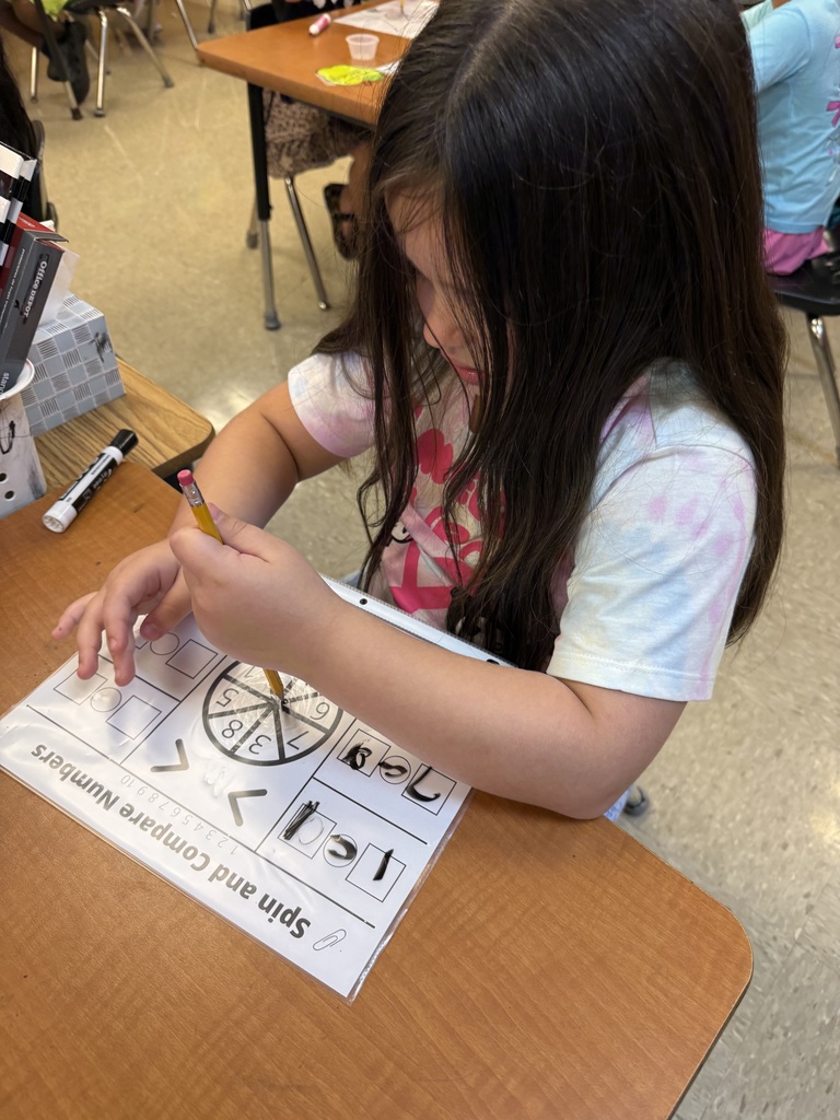 In math we are comparing numbers- today we played a game to review using symbols that that show greater than, less than , and equal to.