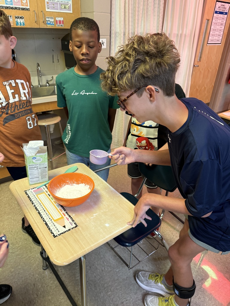 Student adding corn starch 
