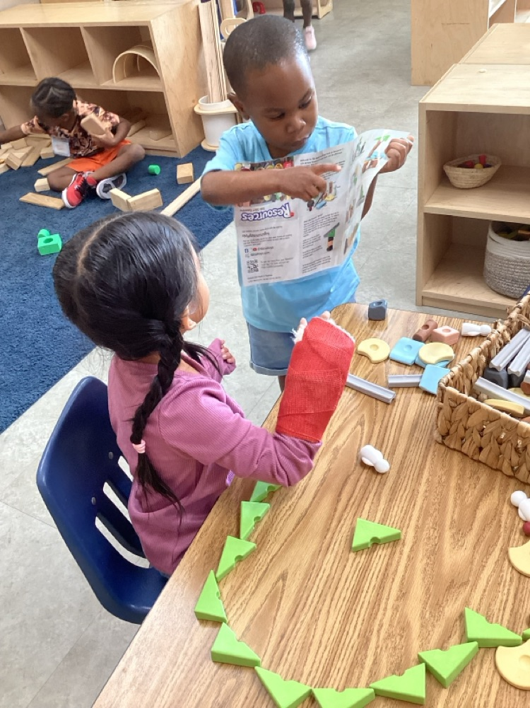 children collaborating to create using loose parts