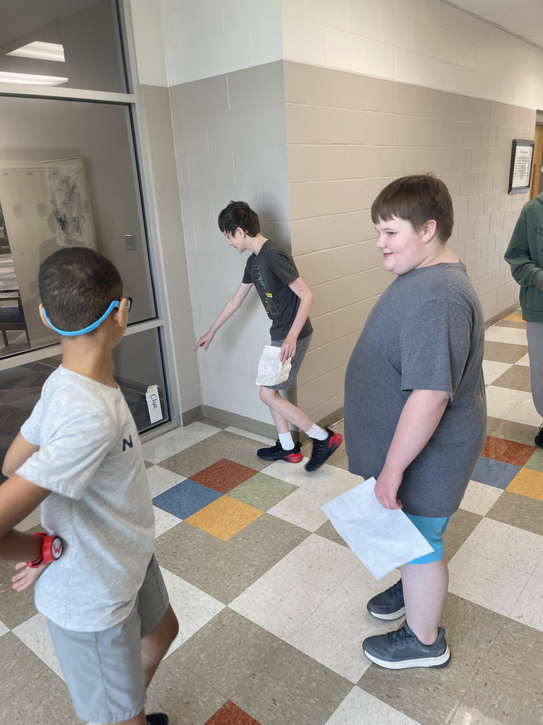 Ms Jackson's class using reading skills and problem solving skills to meet their new class pet.