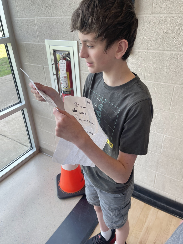 Ms Jackson's class using reading skills and problem solving skills to meet their new class pet.